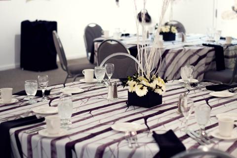 Decorated table with water, featuring a custom centerpiece